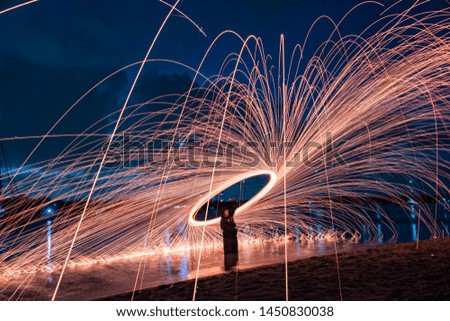Display of steel wool spinning at night