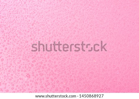 Close up of water drops on rose pink tone background. Abstract pink wet texture with bubbles on plastic PVC surface or grunge. Realistic pure water droplets condensed. Detail of canvas leather texture