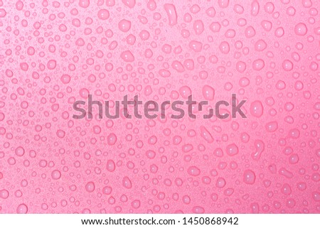 Close up of water drops on rose pink tone background. Abstract pink wet texture with bubbles on plastic PVC surface or grunge. Realistic pure water droplets condensed. Detail of canvas leather texture