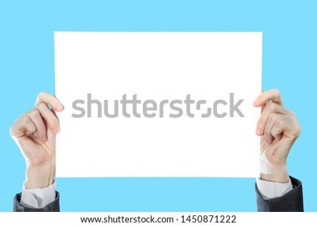 Businesswoman hands holding blank paper for text advertising copyspace.