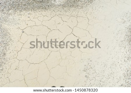 Close up of crack soil and muddy in the dry season textures, hot summer. Patterns and texture cracked soil of sunny dried earth soil, Drought of the ground. Dried cracked earth soil ground background