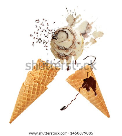 Vanilla and chocolate ice cream with waffle cones isolated on white background.