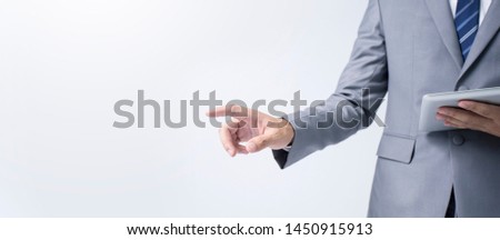 Confident business personality for selling with his finger pointing isolated on banner background with copy space.
