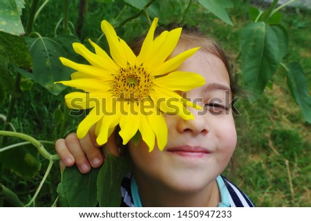 girl with sunflower greens smile