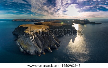 Aerial view of Nordkapp (North Cape) in the extreme part of Norway over the blue sea Royalty-Free Stock Photo #1450963943