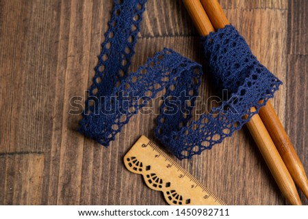 knitted openwork linen ribbon tapes in rural style of rustics cotton eco natural on wood ground
