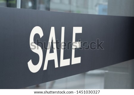 Inscription Sale in shop window