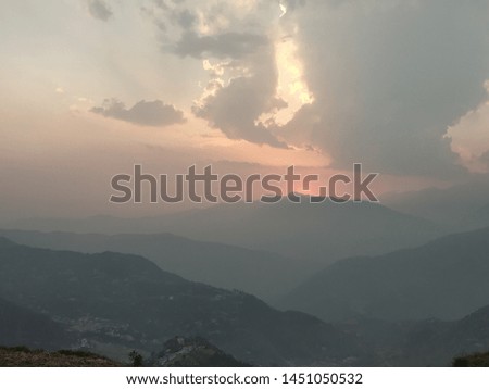 Sunset between beautiful mountains and sky