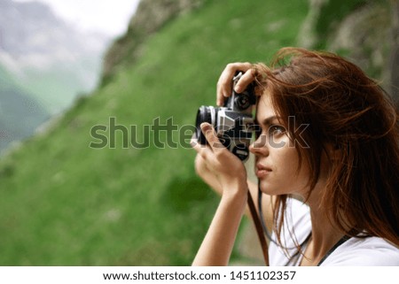 woman with camera nature summer mountains landscape