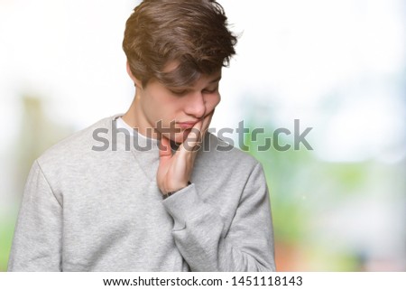 Young handsome sporty man wearing sweatshirt over isolated background thinking looking tired and bored with depression problems with crossed arms.