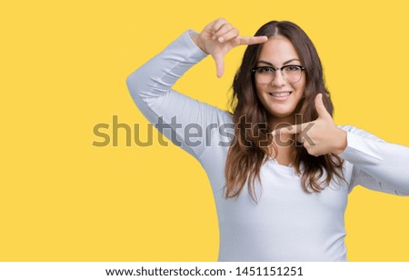 Beautiful plus size young woman over isolated background smiling making frame with hands and fingers with happy face. Creativity and photography concept.