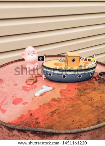 Old retro children's toys: Bunny, watering can, boat and monkey. Vintage instagram style