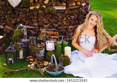 
beautiful girl in a flower wreath on the background of the decorated area