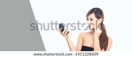 Beauty photography beautiful asian young woman with clean fresh skin, wearing black folded powder in beauty shoot studio on isolated white background and gray banner.