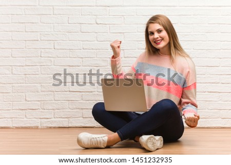 Young russian student woman sitting who does not surrender
