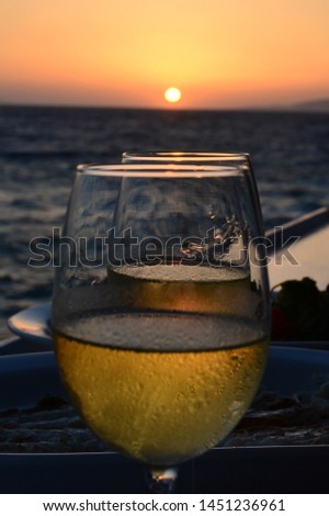 Shot in Mykonos, Greece. Wine glasses shot against a beautiful sunset. 
