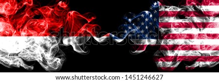 Indonesia vs United States of America, American smoky mystic flags placed side by side. Thick colored silky smoke flags of Indonesia and United States of America, American