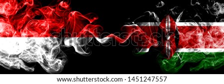 Indonesia vs Kenya, Kenyan smoky mystic flags placed side by side. Thick colored silky smoke flags of Indonesia and Kenya, Kenyan