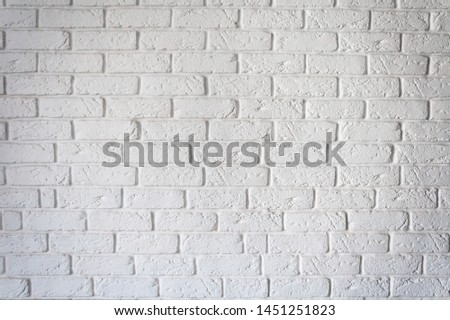Decorative rough white brick wall background texture