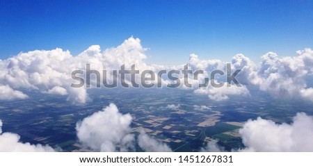 Aerial view of Bologna city and fluffy clouds