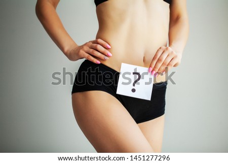 Health. Woman Body In Underwear With Question Card Near Belly