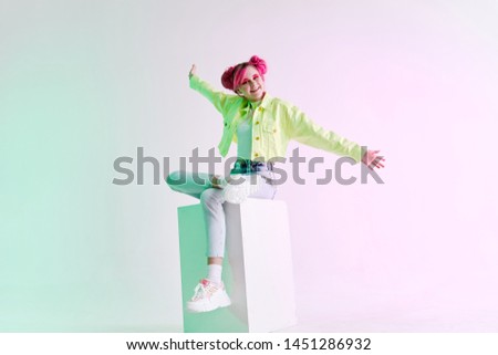 woman with a sit hair on a cube