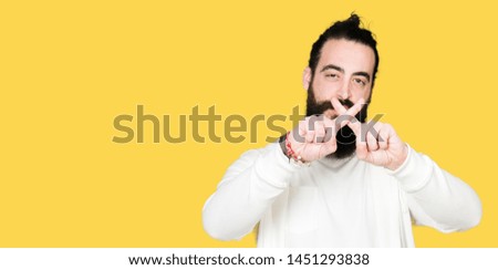 Young hipster man with long hair and beard wearing sporty sweatshirt Rejection expression crossing fingers doing negative sign