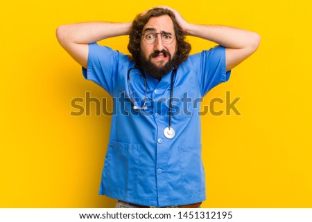 young nurse man  scared pose