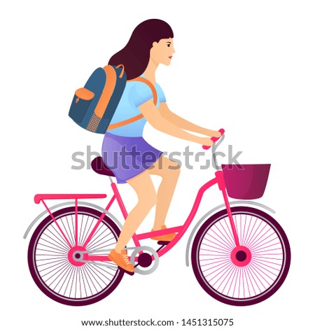 Girl with a backpack riding a bike. Back to school concept