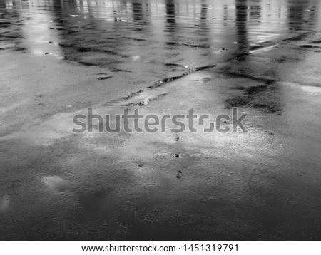 texture of wet asphalt road after rain Royalty-Free Stock Photo #1451319791