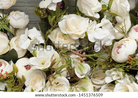 Artificial white flowers in bouquet decoration of marriages
