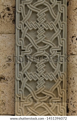 Elements of architectural decorations of buildings, gypsum stucco, plaster ornaments and patterns, wall texture. On the streets in Georgia, public places.