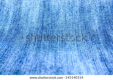 the picture of full frame background of a blue denim fabric pattern 