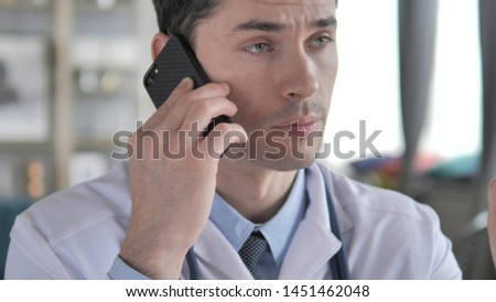 Doctor Talking on Phone with Patient