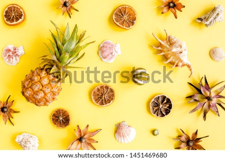 Tropical abstract background, pattern with pineapple on yellow background. Summer concept. Flat lay, top view.