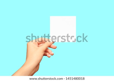 Hand holding blank note card simply