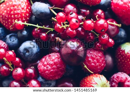 Various summer berries texture background. Large collection of freshly picked ripe berries. Agriculture, gardening, harvest concept. Top view. Copy space.