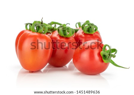 Group of four whole fresh red tomato cherry isolated on white background