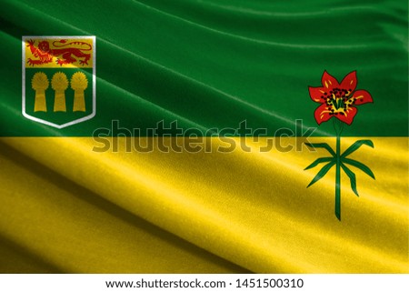 Realistic flag of Saskatchewan on the wavy surface of fabric