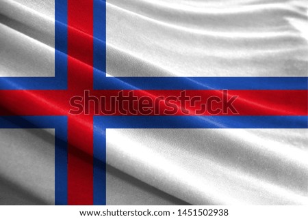 Realistic flag of Faroe Islands on the wavy surface of fabric