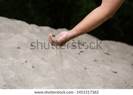 Time Sand running through hand