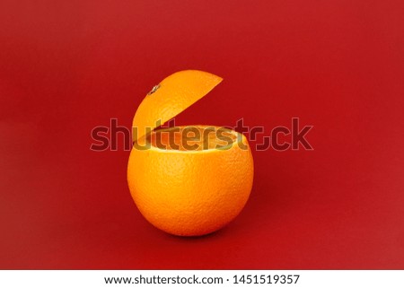 Healthy Orange Cut floating top slice juice drink idea concept on red background