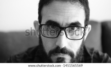 Adult man with beard serious Close Up. Black and white photo