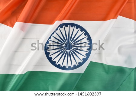 Top view of National Flag of India on white wooden background. I