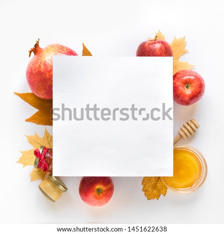 Rosh hashanah (jewish New Year holiday) concept. Creative layout of traditional symbols, top view, copy space. Royalty-Free Stock Photo #1451622638