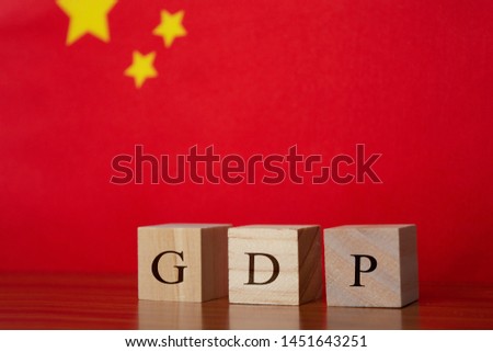 Concept of Gross Domestic Product or GDP of Germany, GDP in wooden block letter on German Flag.