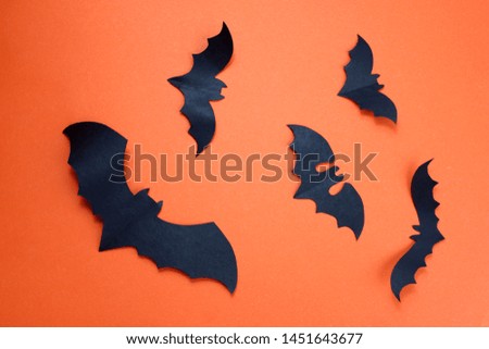 Halloween holiday concept with paper black bats.a