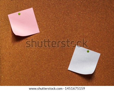 Cork board with blank notes with pins. 