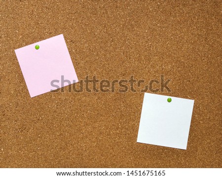 Cork board with blank notes with pins. 
