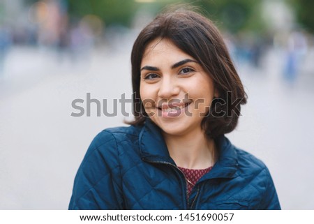 portrait of pretty smiling woman with hazel eyes